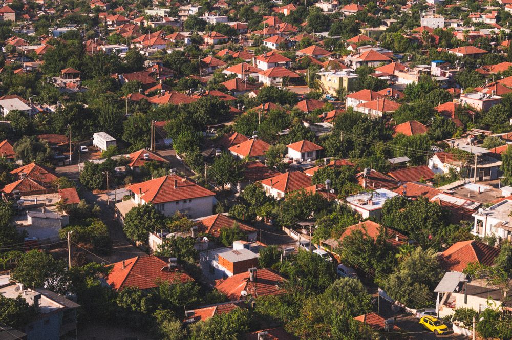 Stock photo: aerial view of a neighbourhood of red-roofed houses and trees